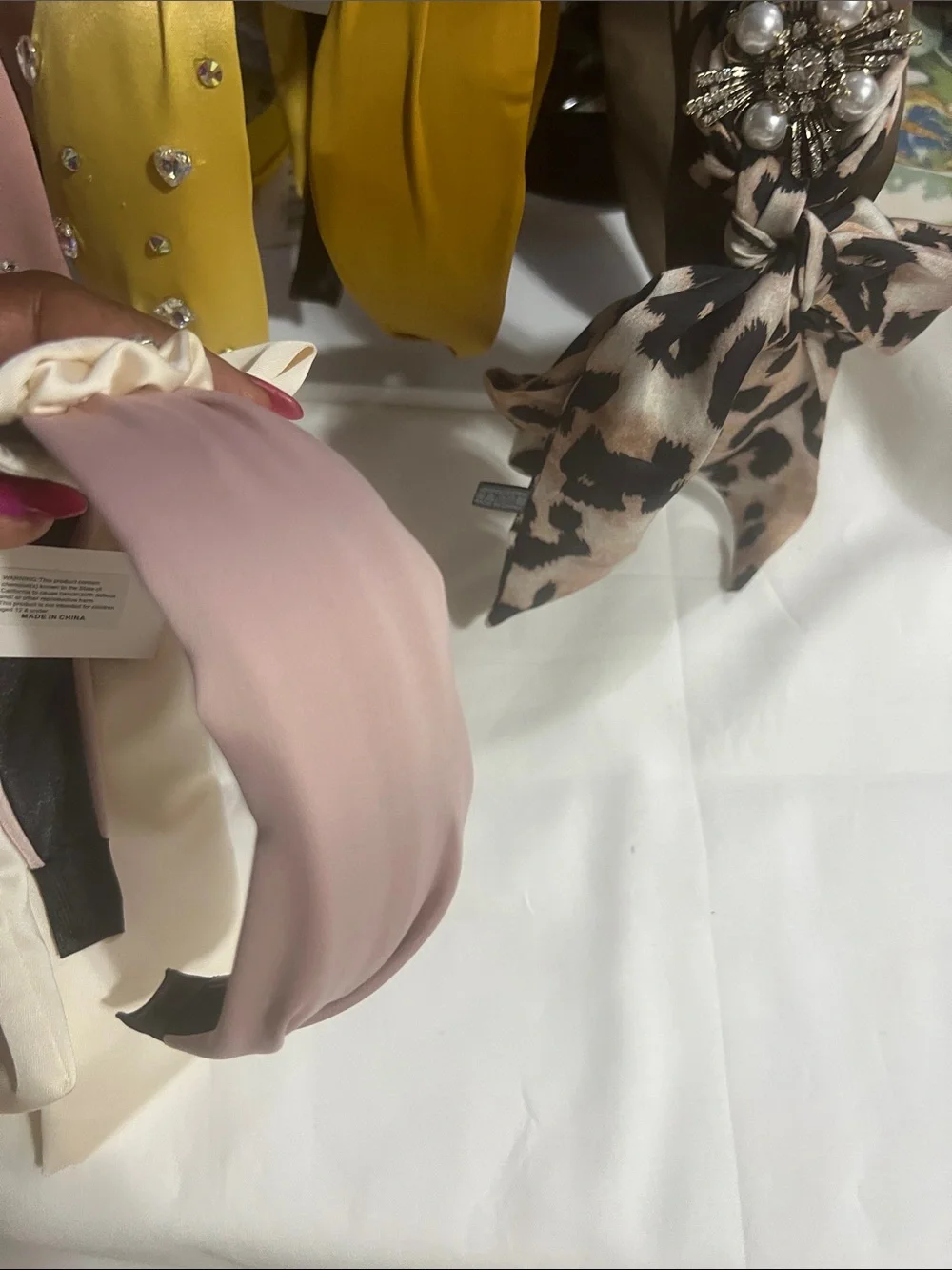 Elegant Pink Satin Headband with Crystal Brooch Accent